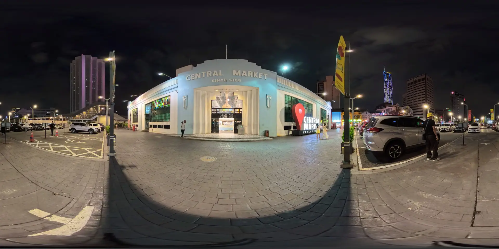 Infront of Central Market at night