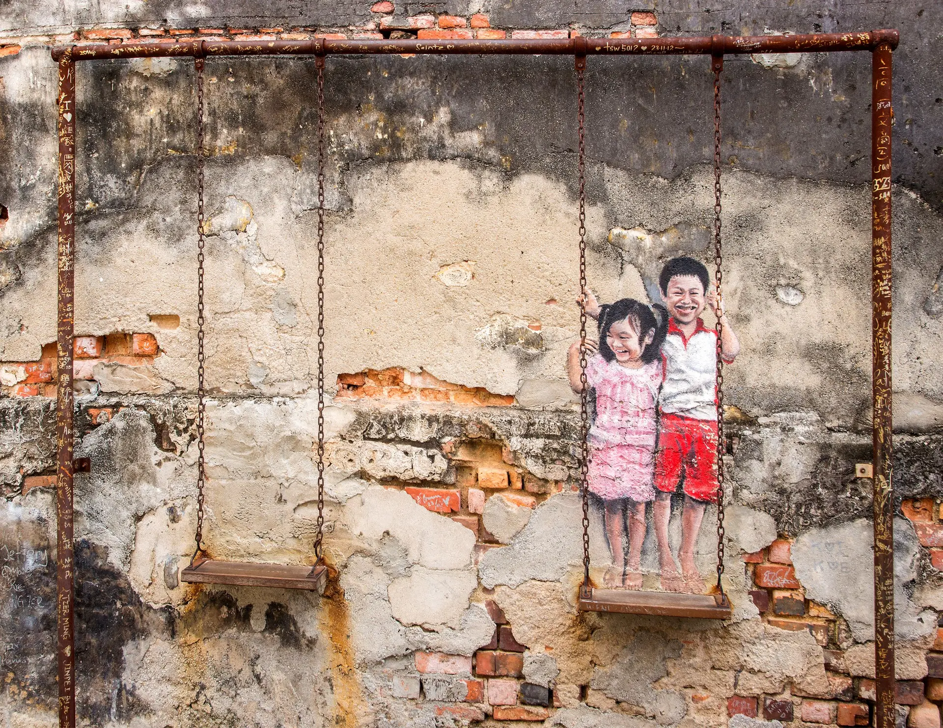 Brother and  Sister on a Swing Street Art - Street Art in George Town